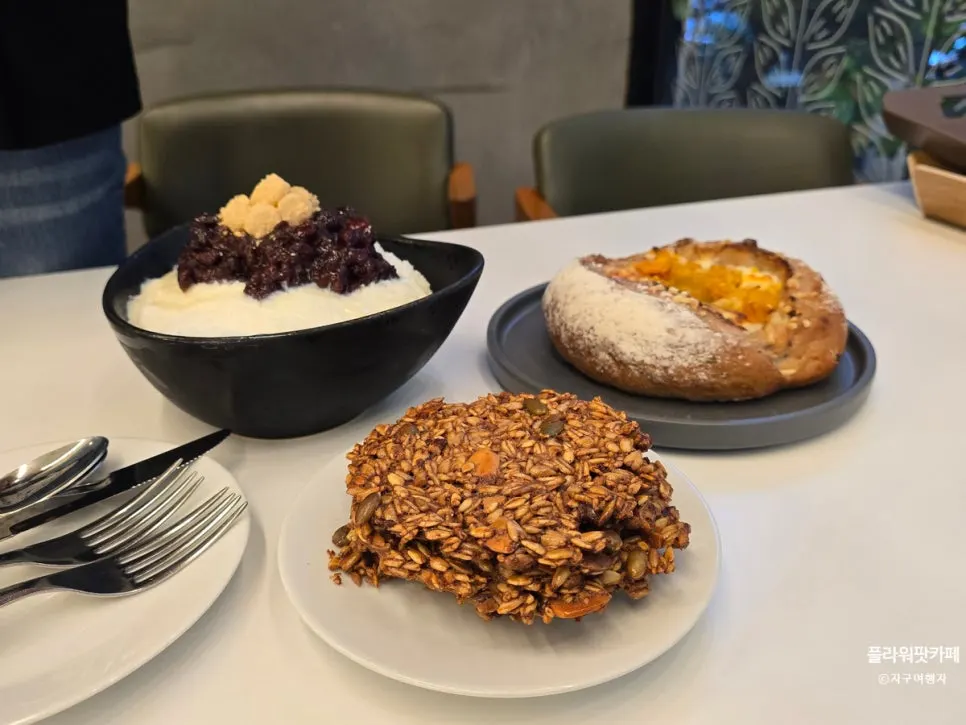 Snow-white bingsu topped with red beans and injeolmi rice cake
