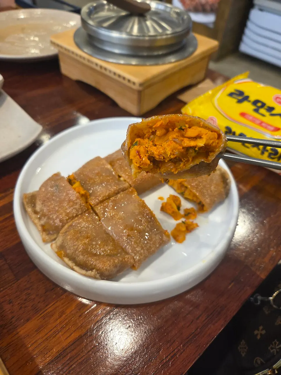 Cross-section of crispy grilled buckwheat kimchi jeonbyeong