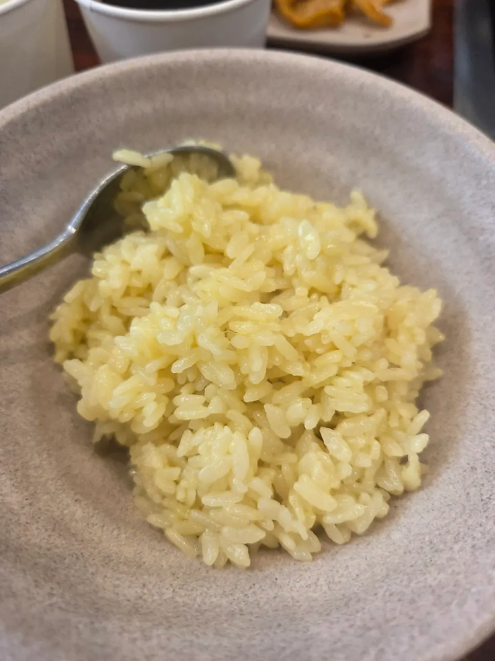 Golden gardenia-colored stone-pot rice