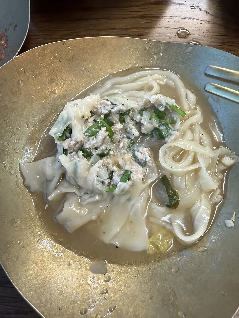 Kalguksu noodles boiled in the chicken broth