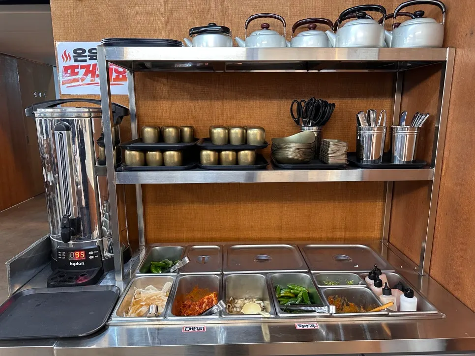 Self-serve bar with side dishes and sauces