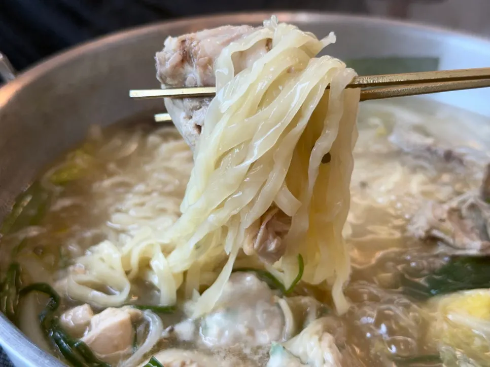 Kalguksu noodles cooked in chicken broth