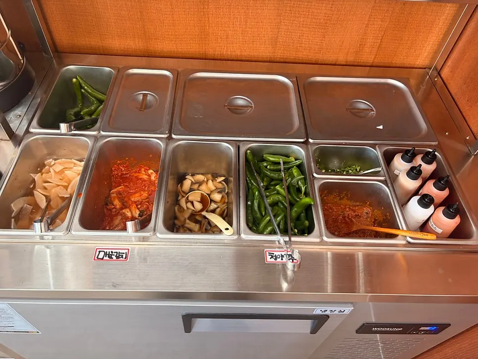 Self-serve bar corner with soy-marinated onions and kimchi