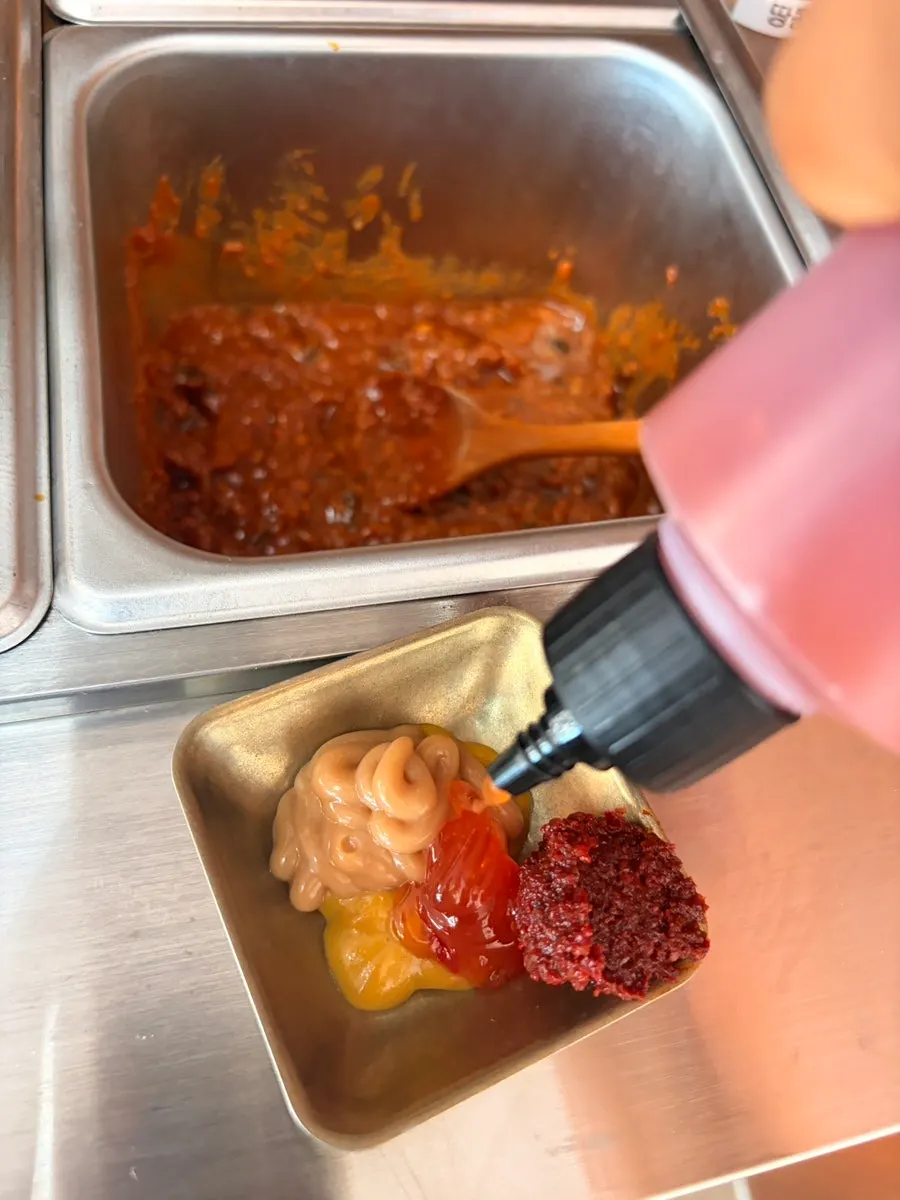 Salt and sauces set out at the self-serve bar