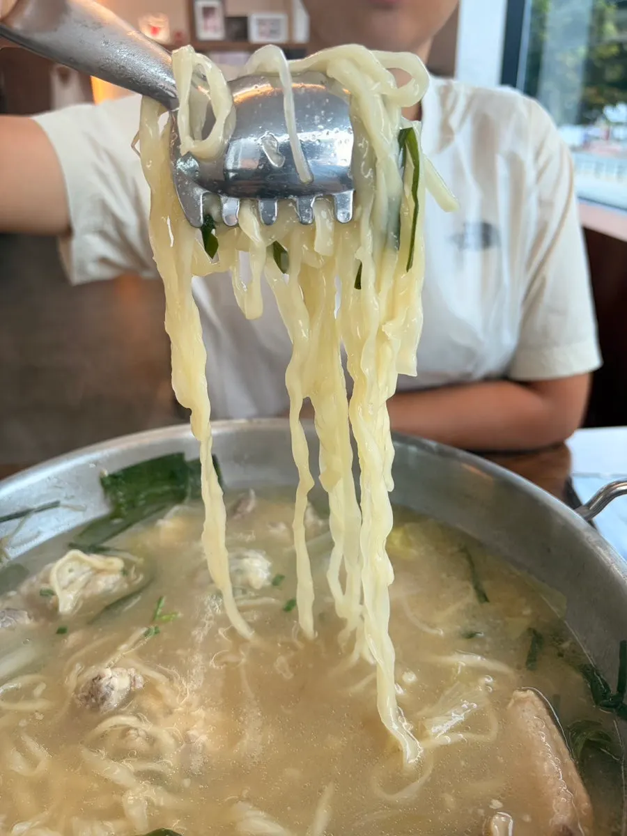 Kalguksu and dumplings served in a bowl