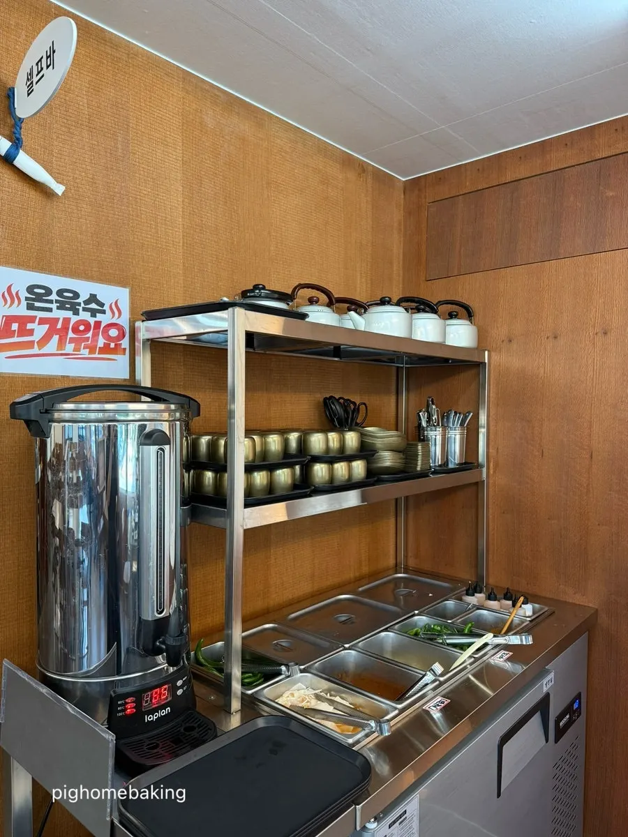 Vinegar, soy sauce, and mustard containers on the table