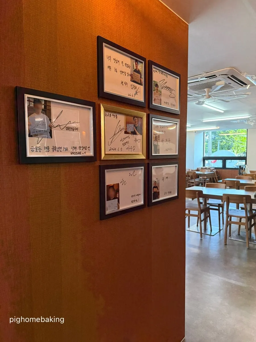 Handwritten signatures on the wall
