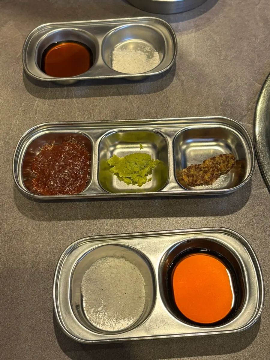 Basic side dish set-up of kimchi, lettuce wraps, and pickles