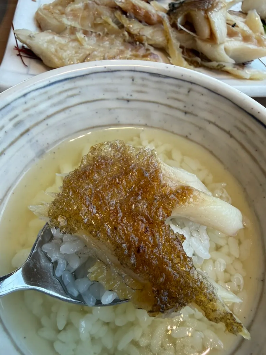 Green tea served alongside the dried corvina