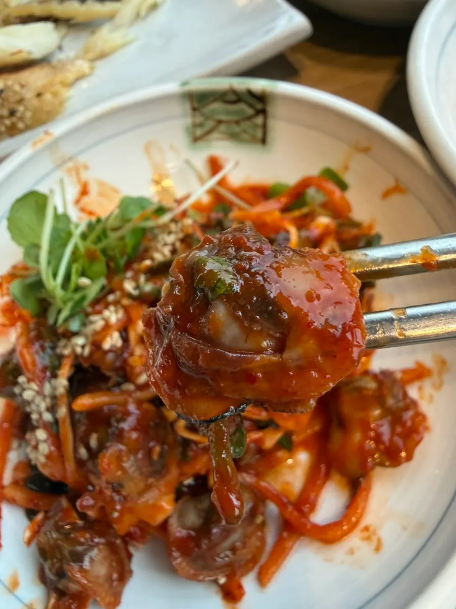 Seasoned cockles served as a side dish