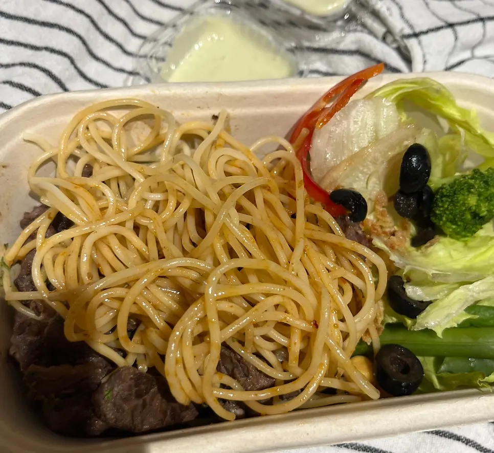 Beef and pasta coated in wasabi mayo sauce