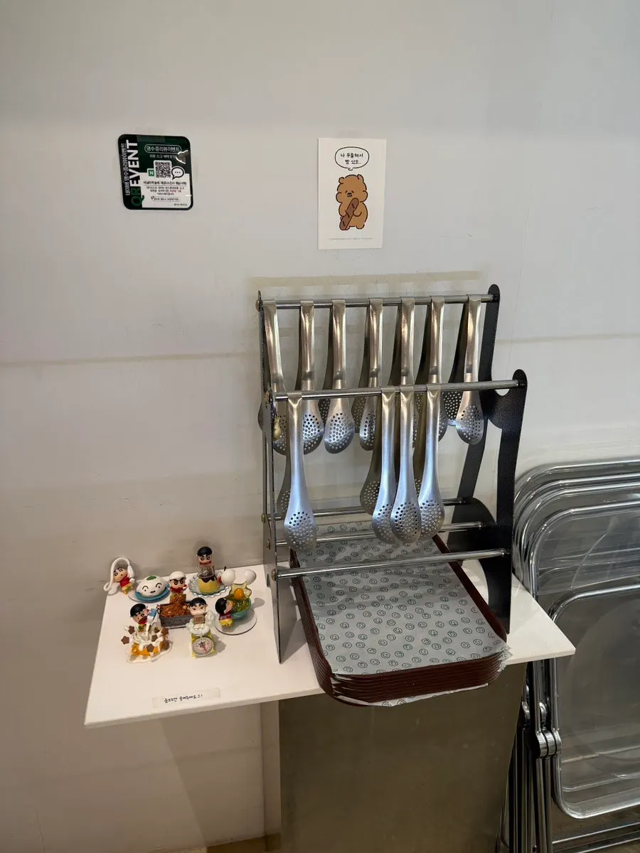 Tongs and trays set up at the entrance