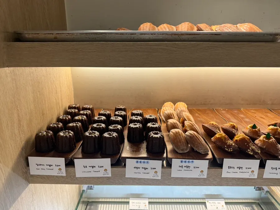 Display case showing rows of different madeleines