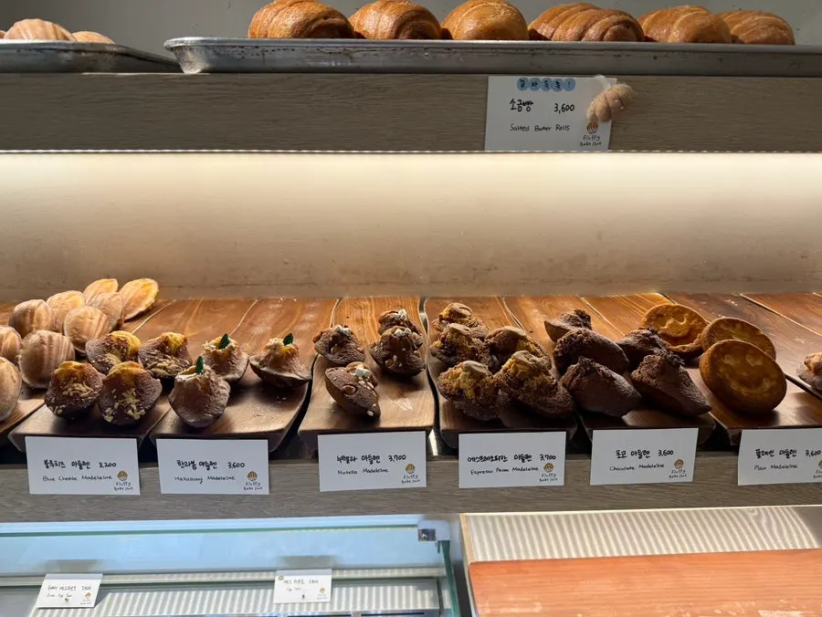 Display of matcha, hwangchiju cheese, raspberry and other madeleines