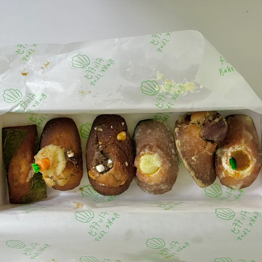 Six pastries arranged on a plate