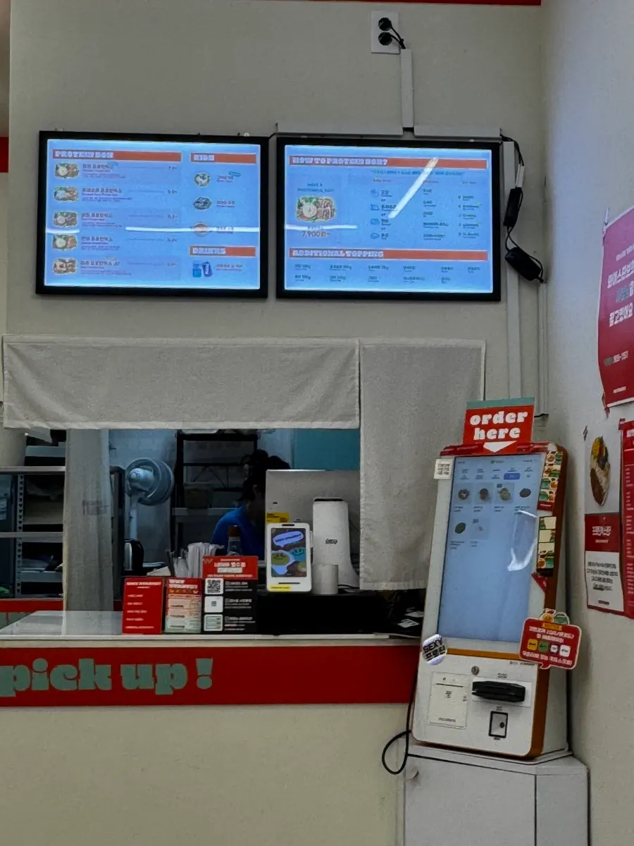 Open kitchen visible from the store entrance