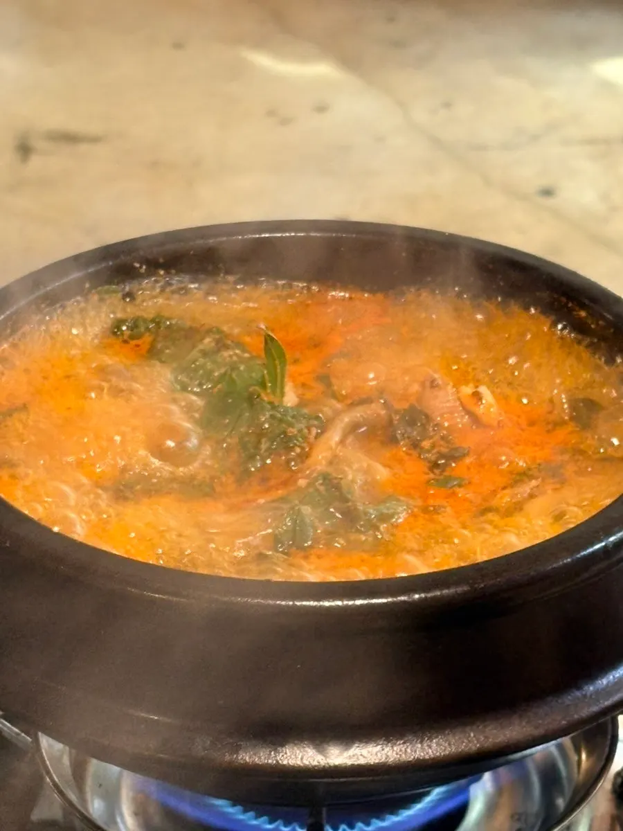 Duck potato stew ingredients in rich broth