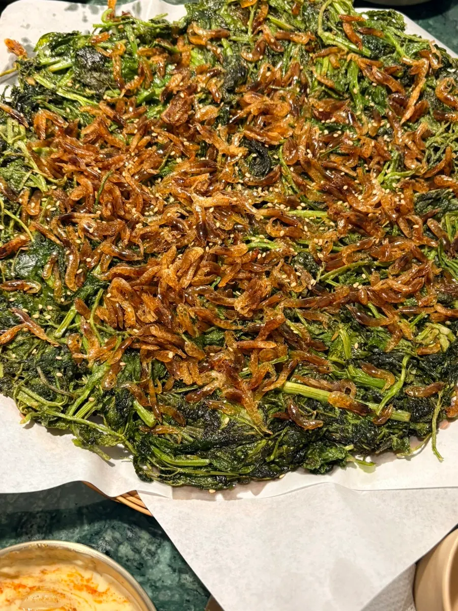 A crisp piece of barley shrimp minari pancake