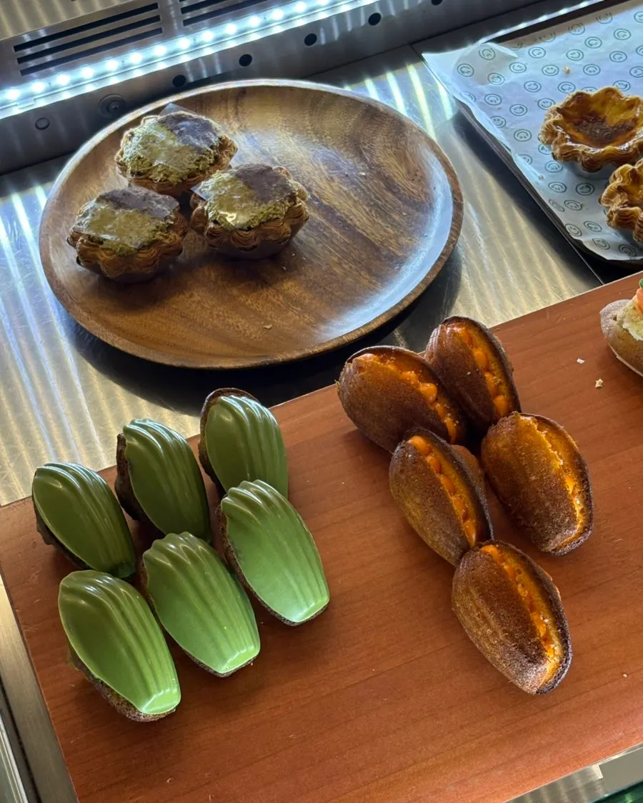 Egg tarts and madeleines on display