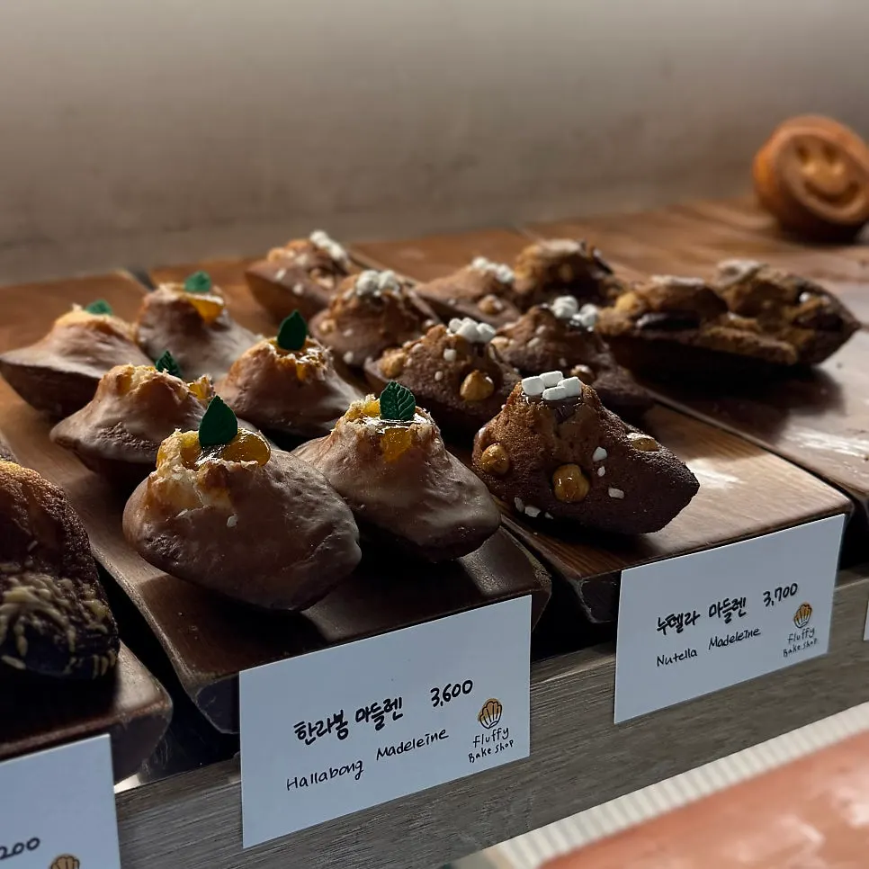 Close-up of madeleines in the display case