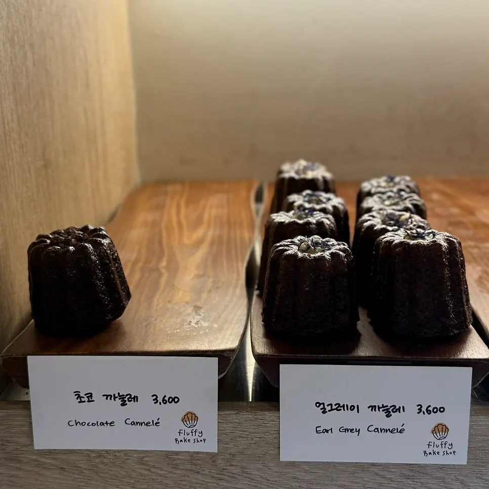 Display case with canelés and egg tarts
