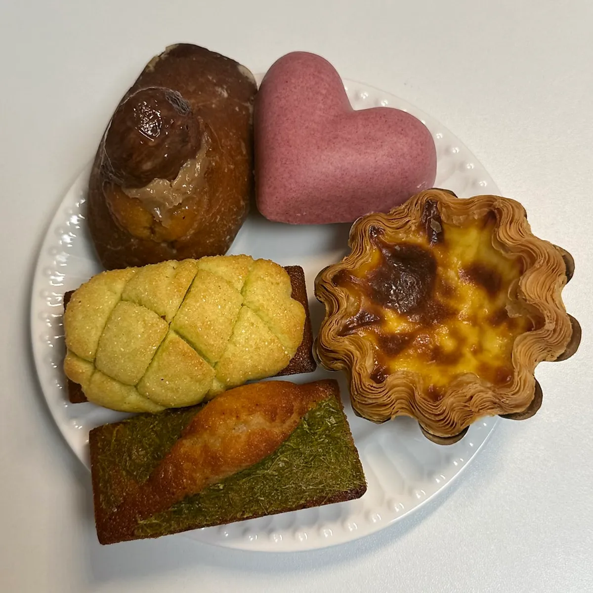 Seven individually wrapped madeleines and financiers