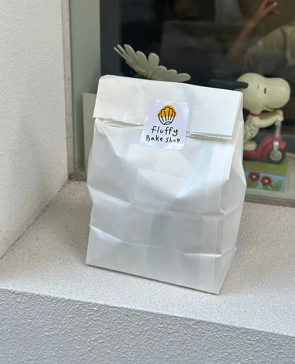 Baked pastries packed in a paper bag