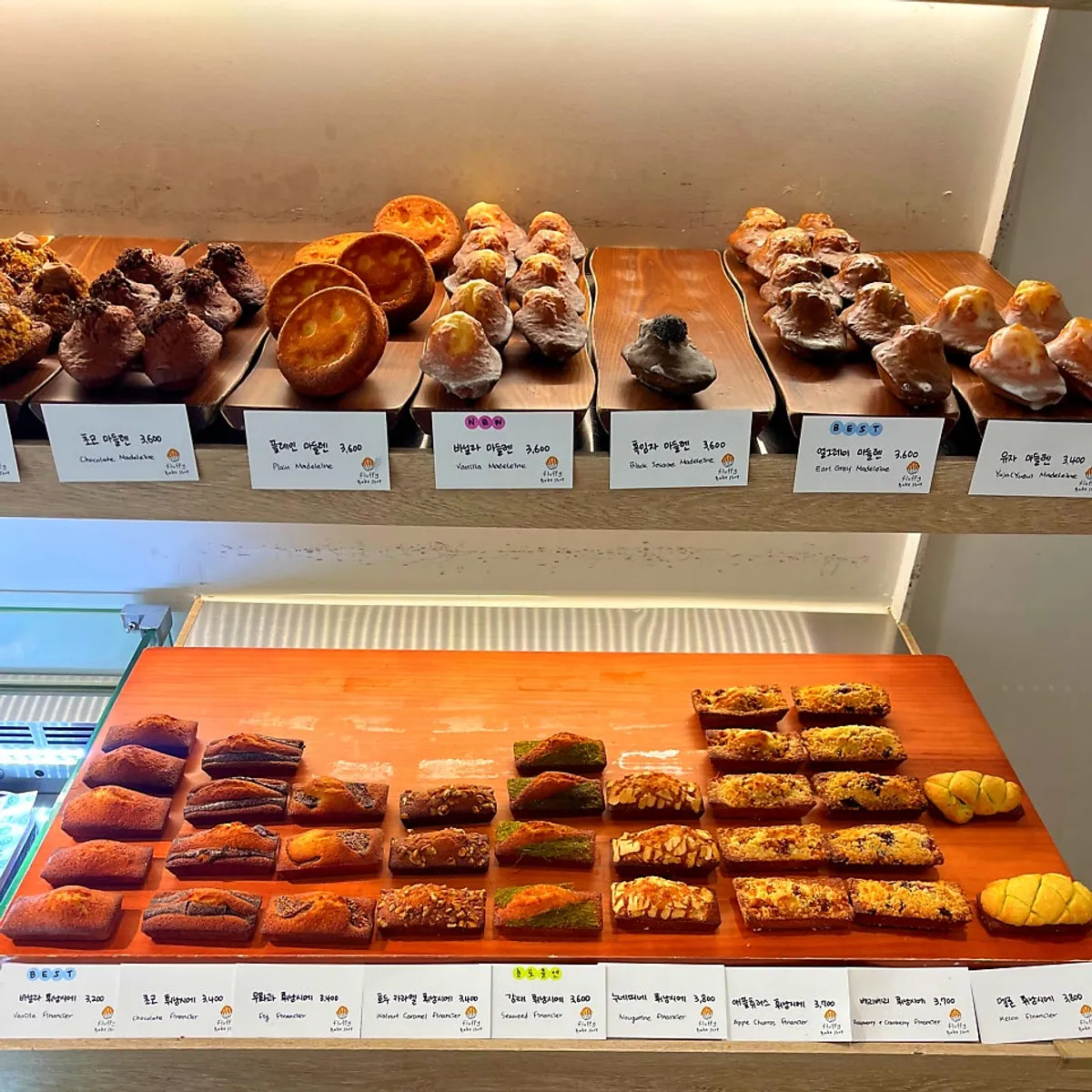 Madeleines neatly arranged on a wooden tray