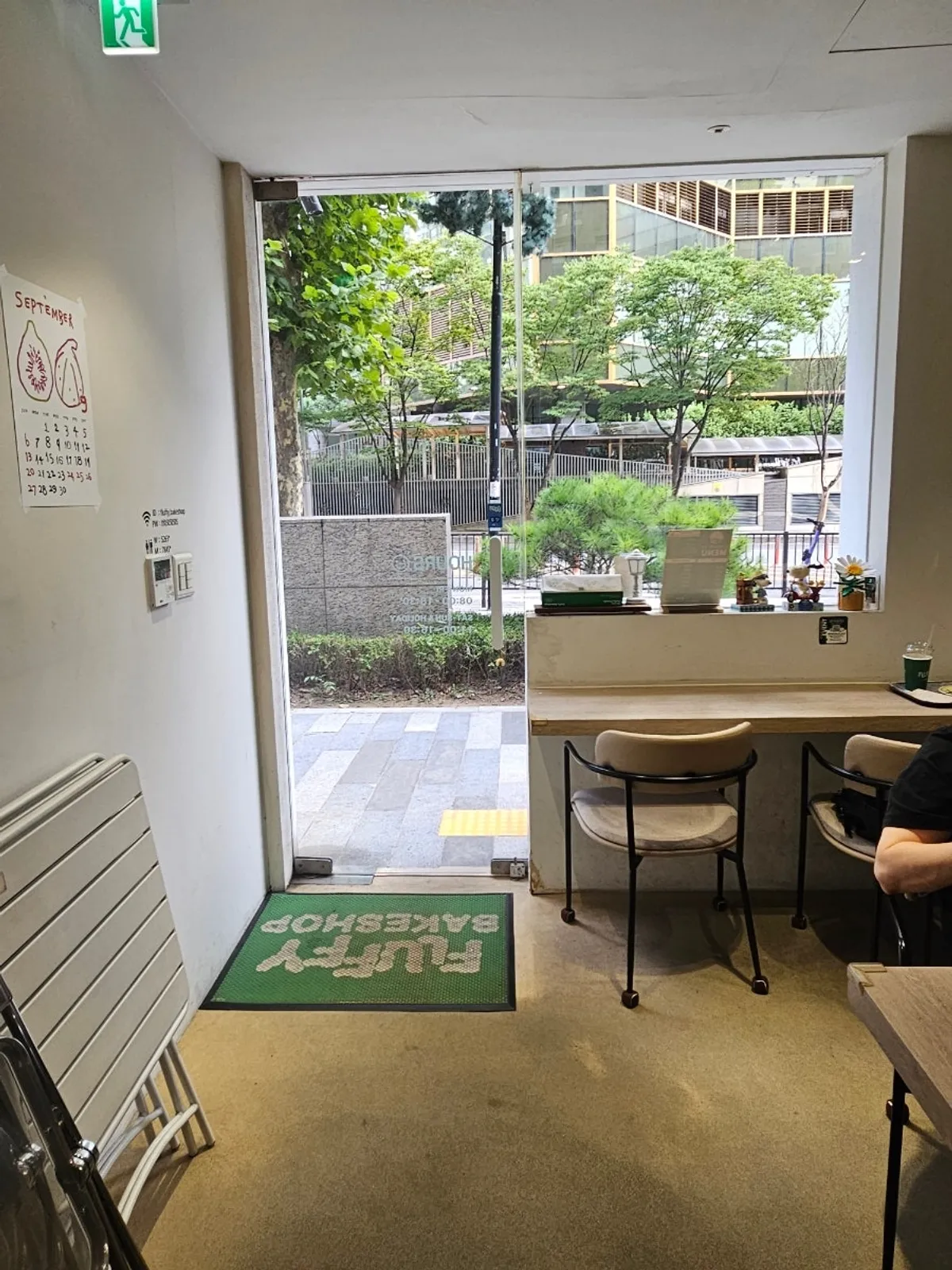 White-toned café interior display with figurines