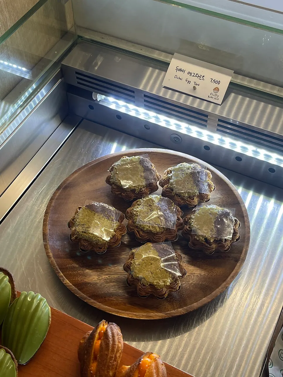 Display case with the Dubai egg tart visible