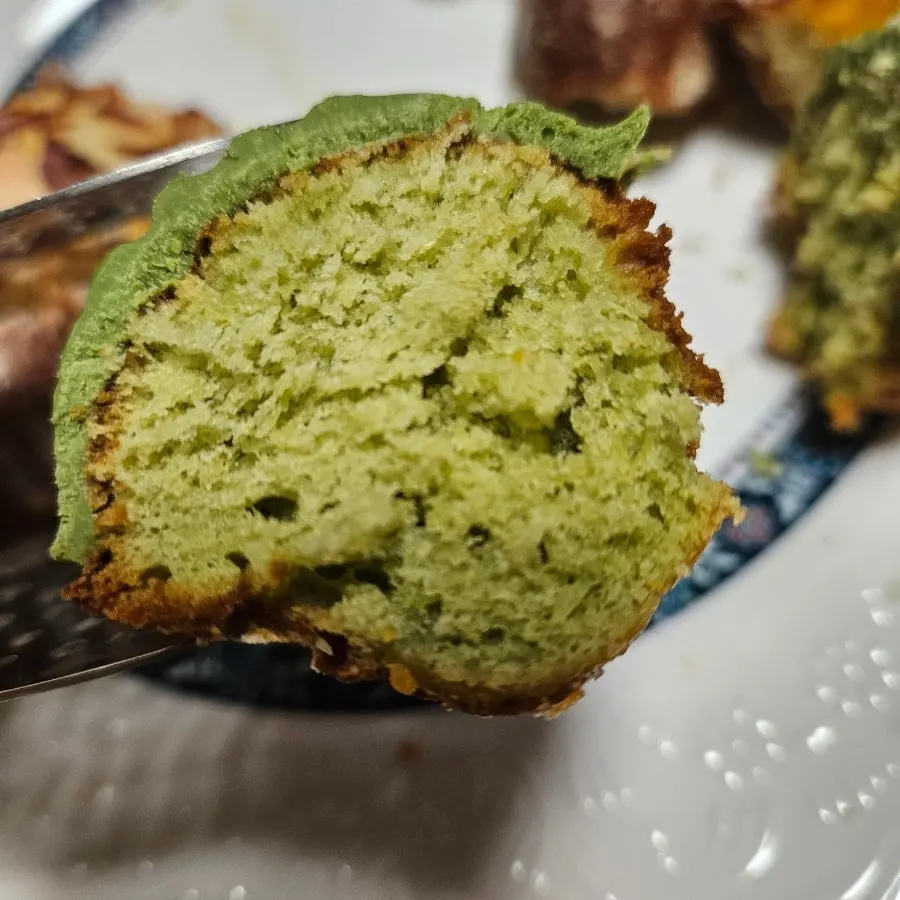 Cross-section of matcha madeleine topped with matcha chocolate