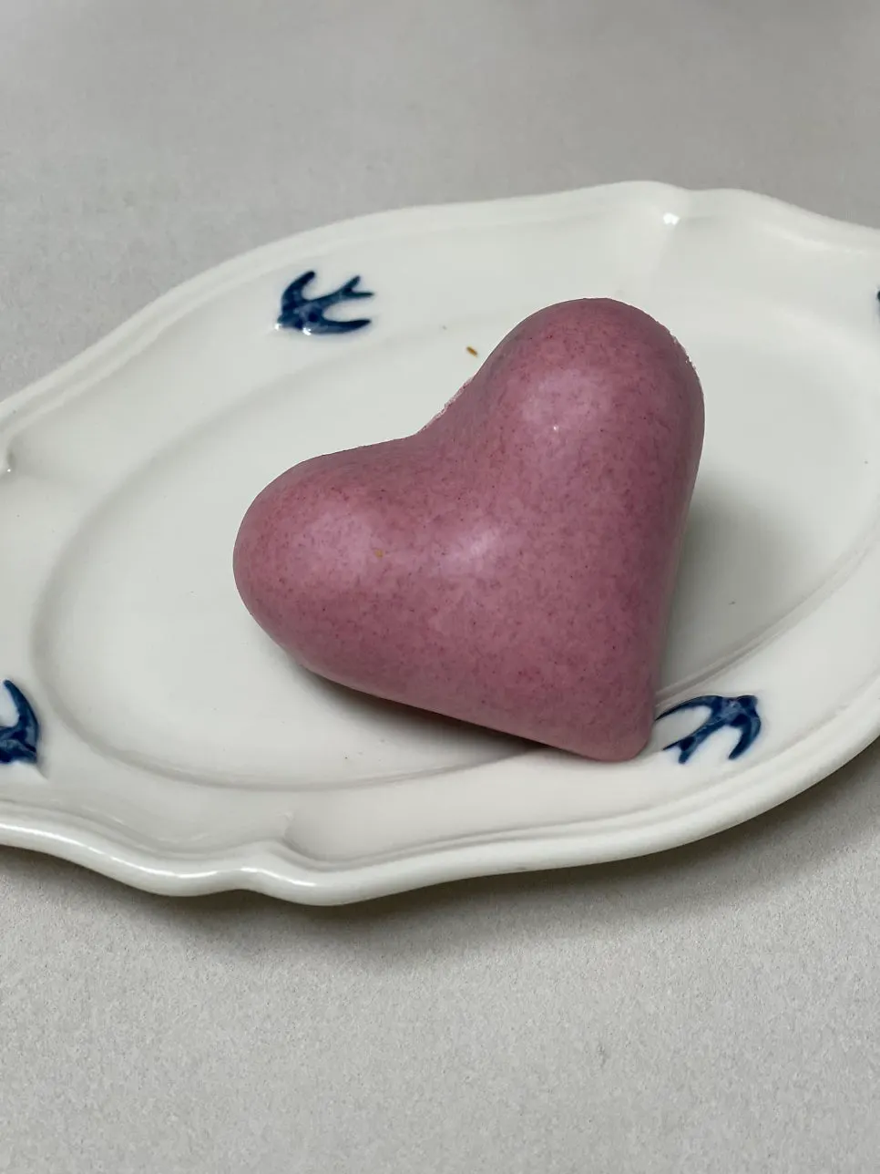 A single raspberry madeleine