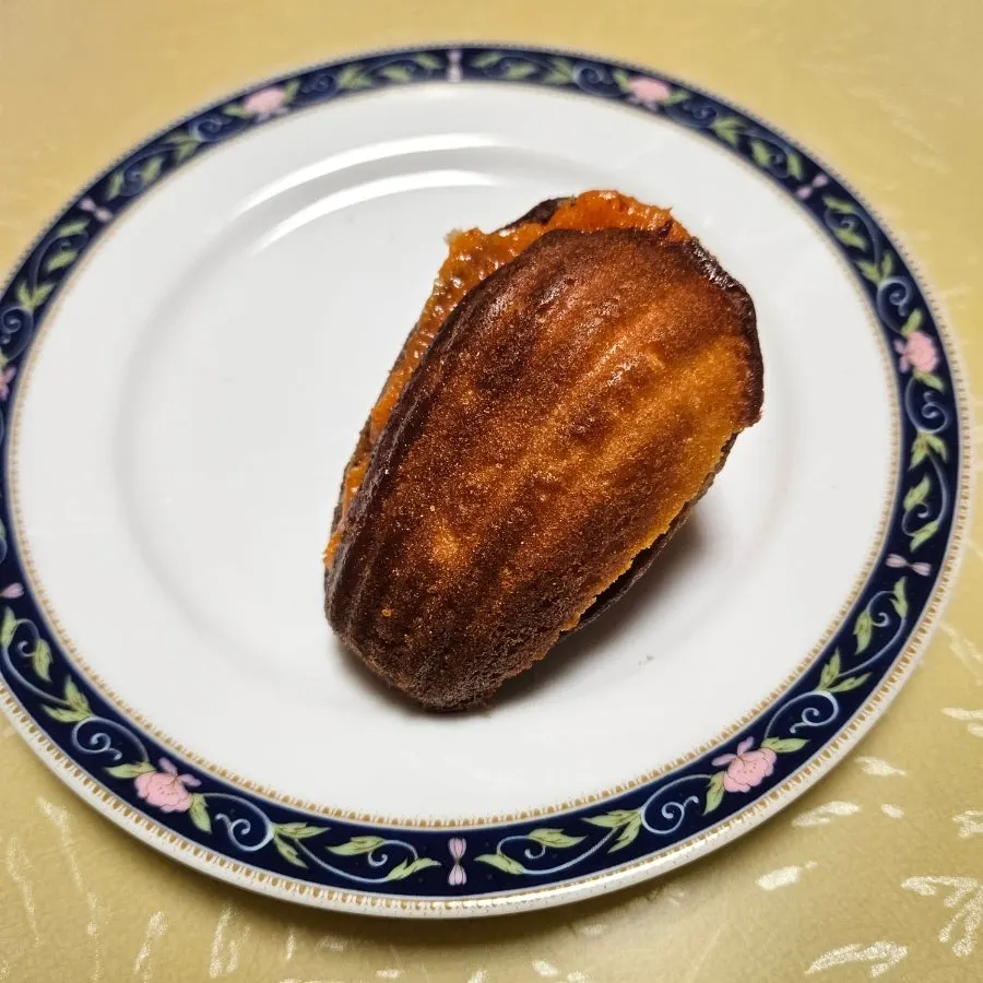 Hwangchiju cheese madeleine topped with cheese powder