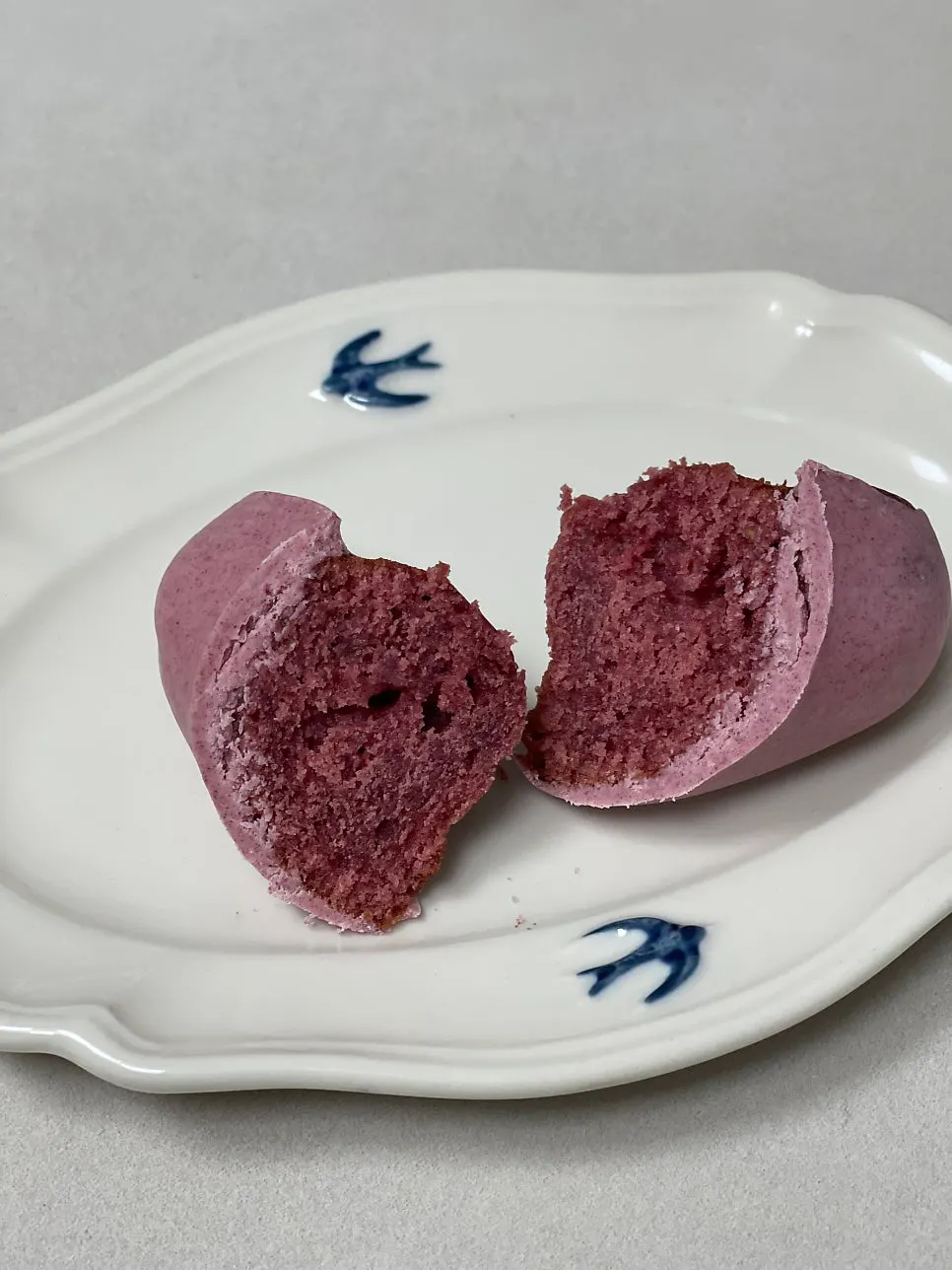 Cross-section of the madeleine showing raspberry flesh