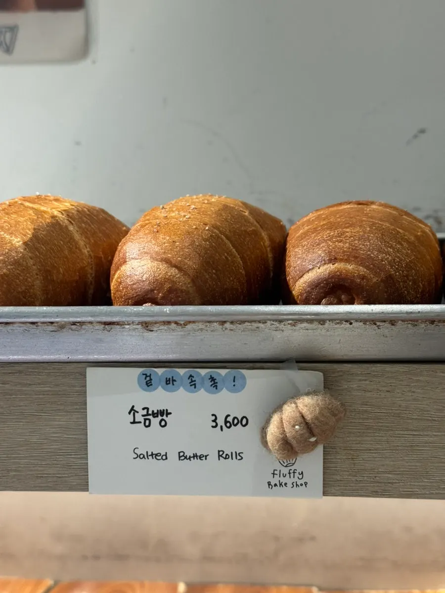 Baked pastries laid out on the display shelf