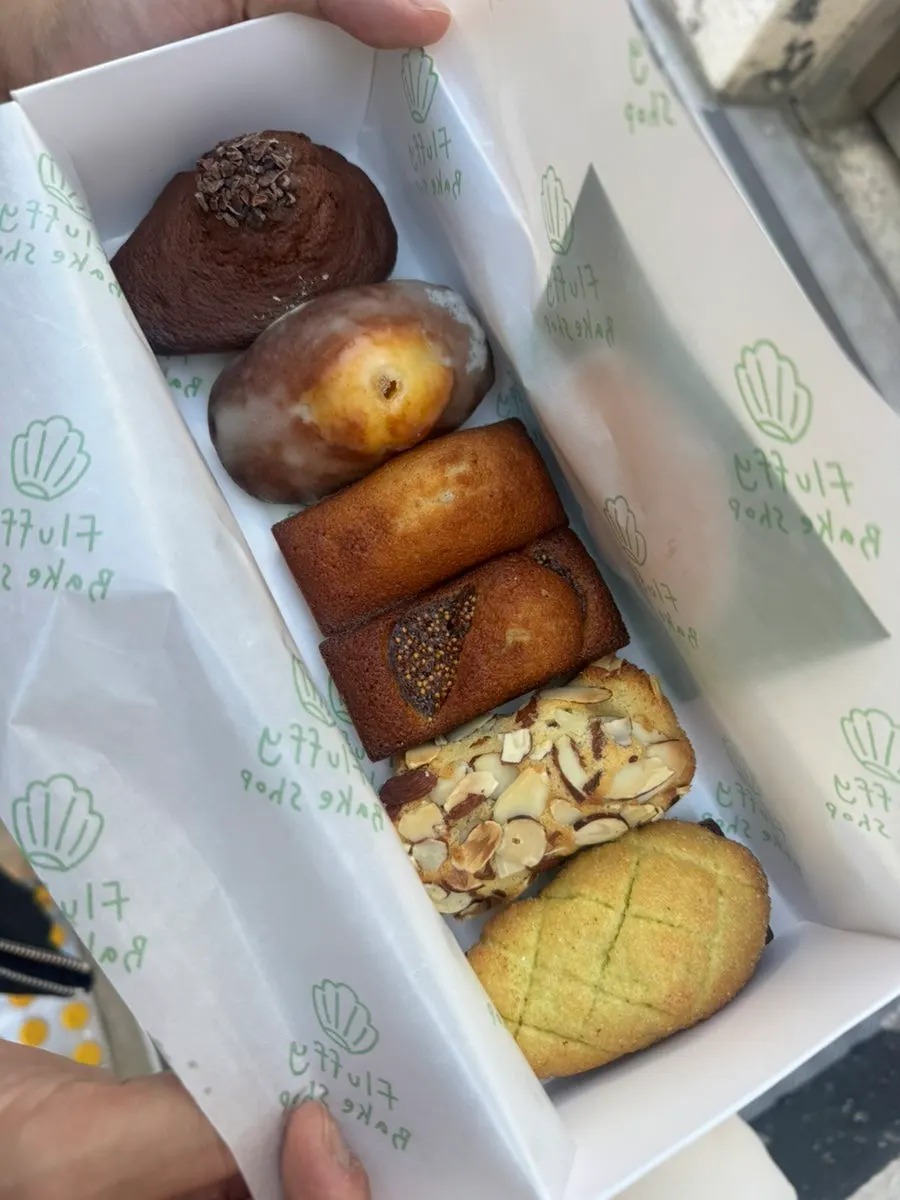A box of baked pastries wrapped as a gift