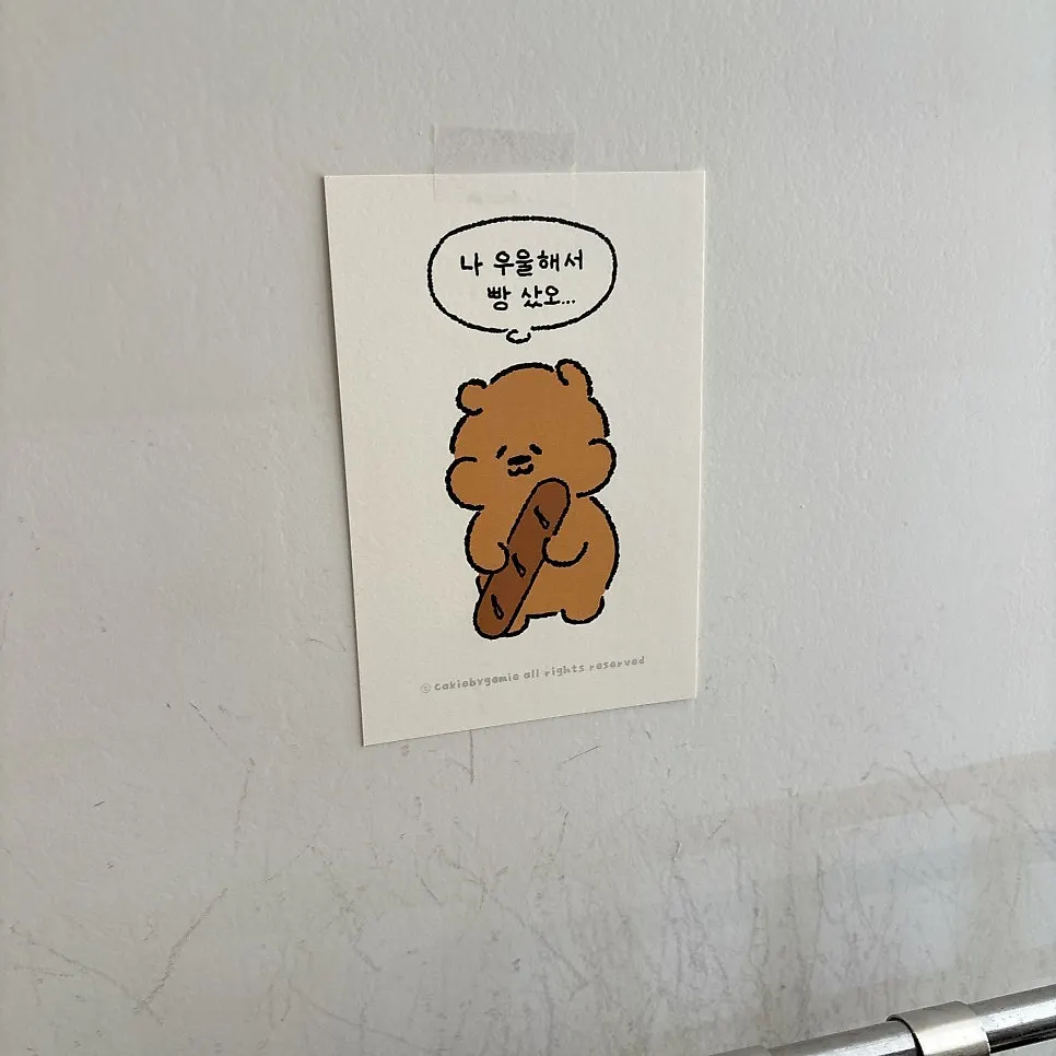 Postcards and small items displayed in the store