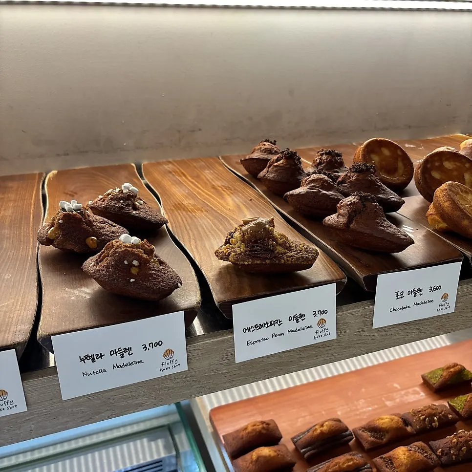 Display case of canelés and madeleines