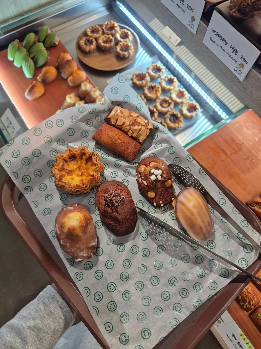 Tray filled with madeleines and financiers