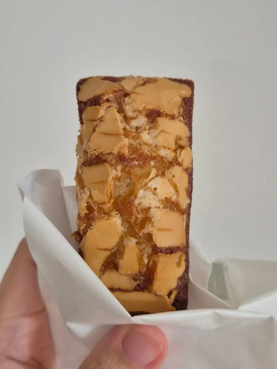 Cross-section of a plain financier showing its moist crumb