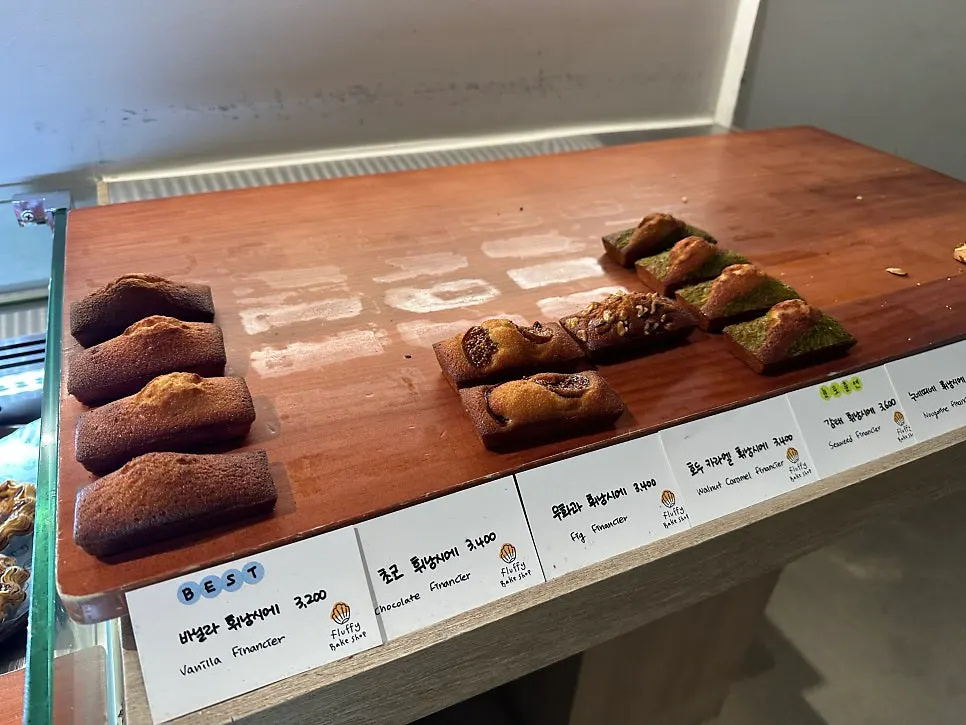Canelés and other pastries on display