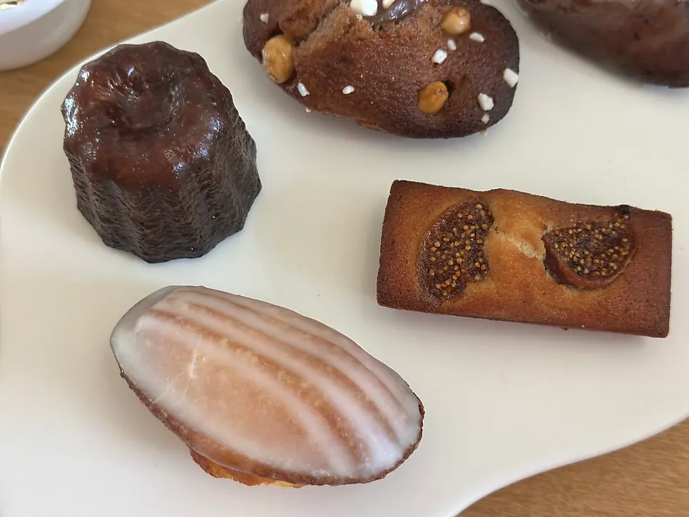 Madeleines and financiers laid out on a table