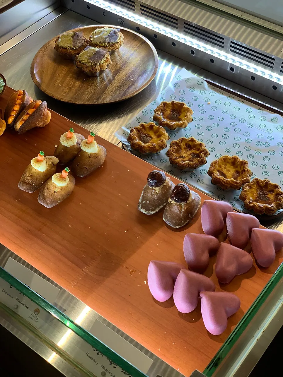 Egg tarts, salt bread, and castella on display