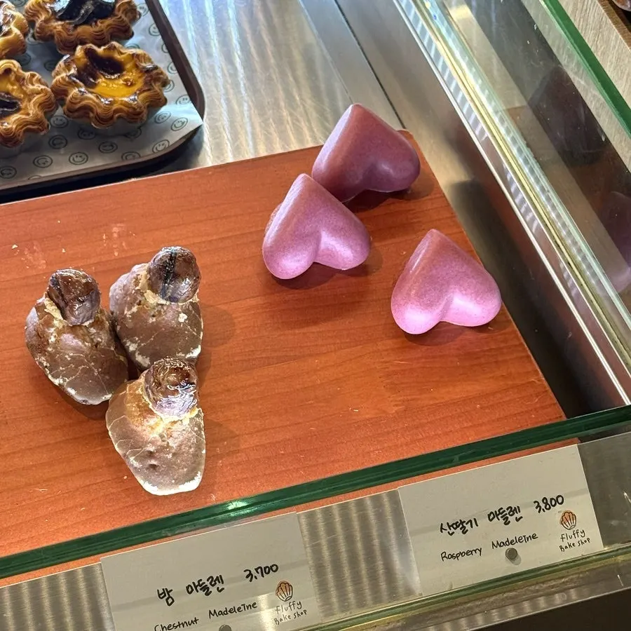 Black sesame, Earl Grey, and yuzu madeleines on display