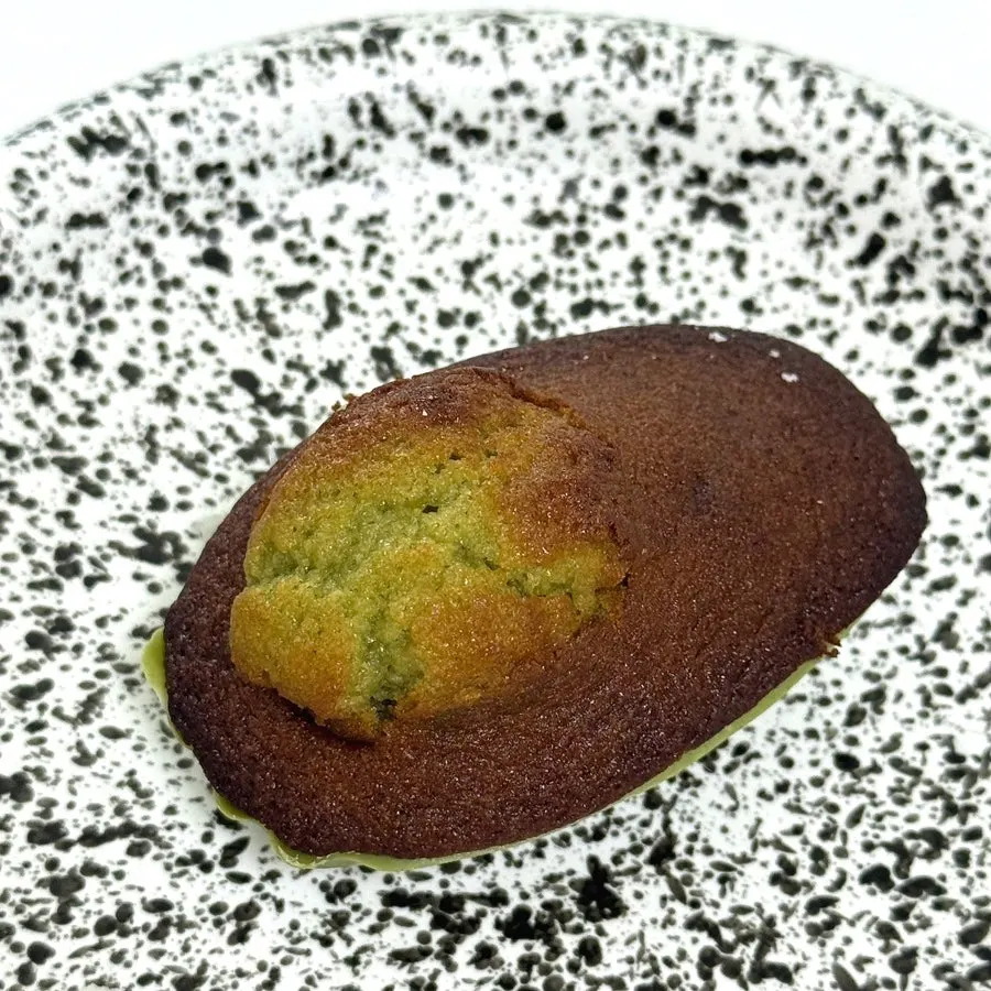 Cross-section of matcha madeleine showing thick belly button