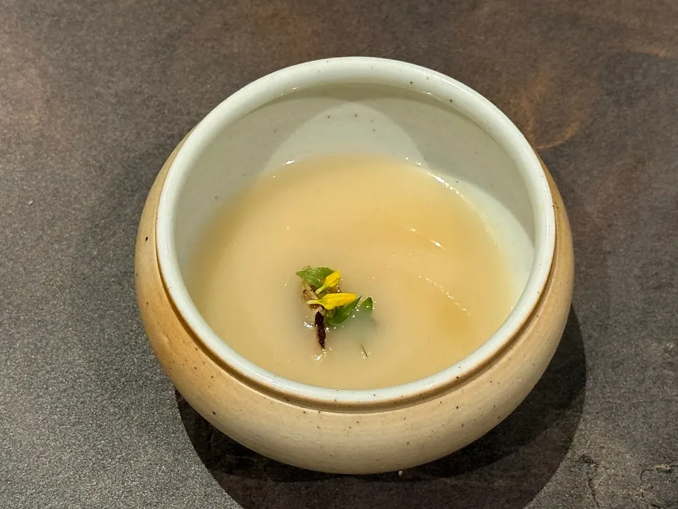 The first course dish, a bowl of beef and chicken jinjuk porridge