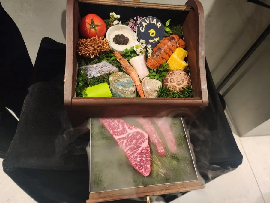 Course ingredients introduced in a wooden box