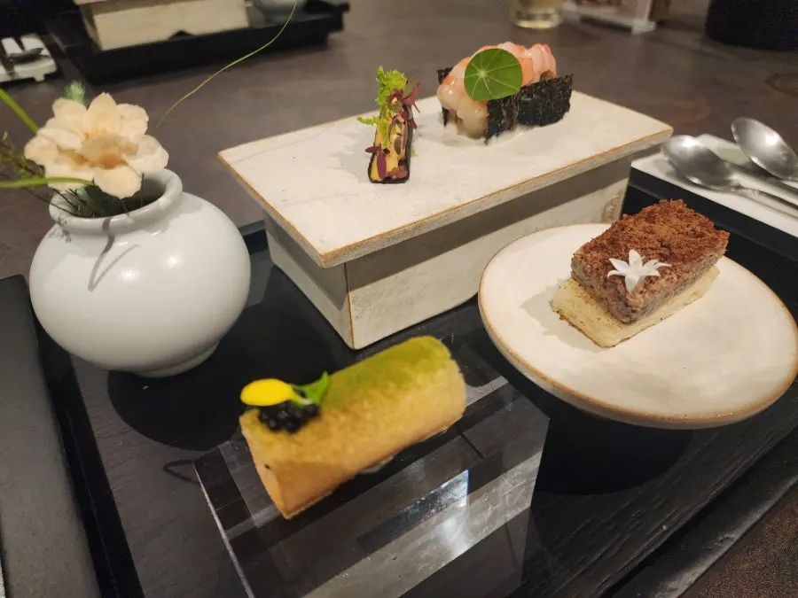 Plate of four bite-sized dishes