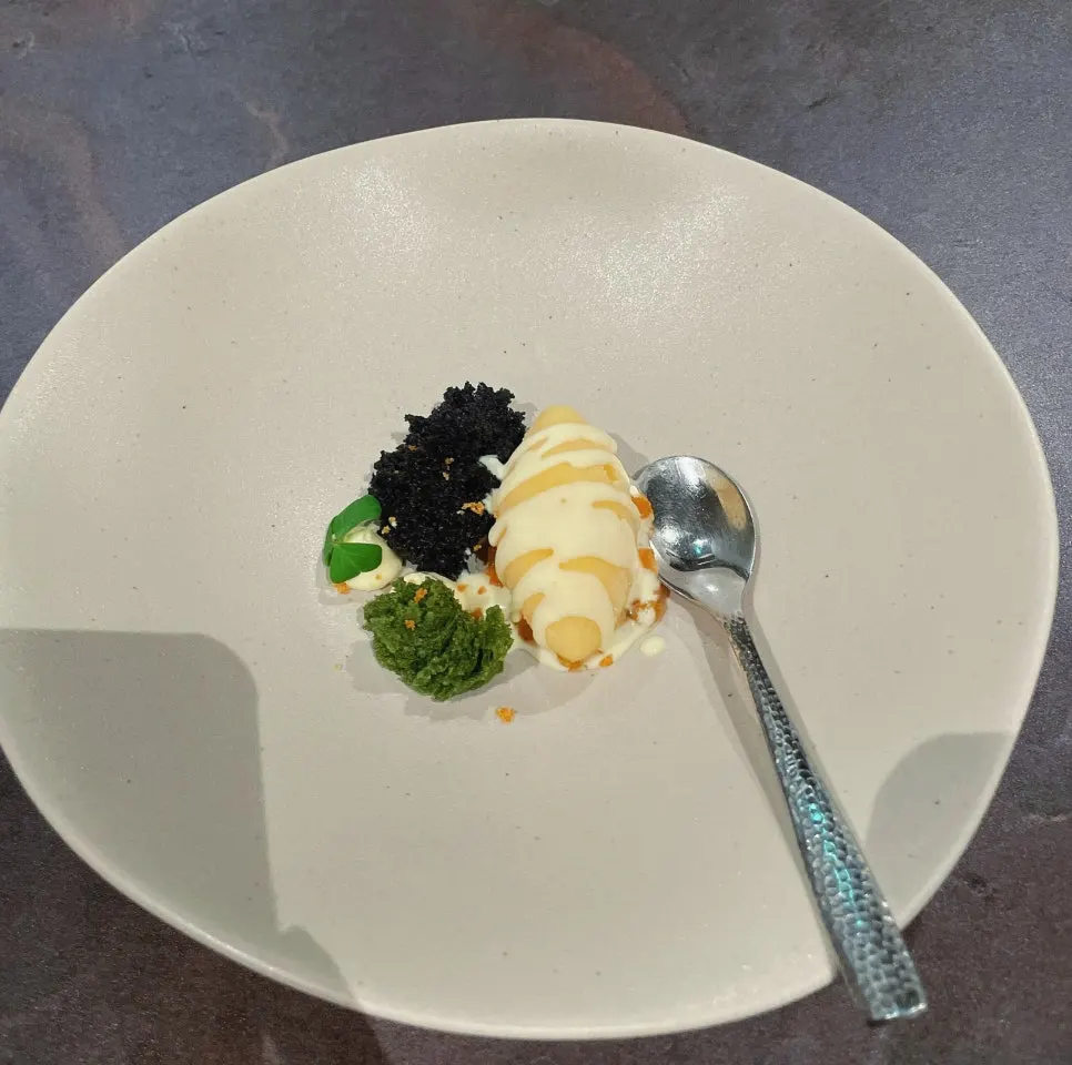 Corn ice cream dessert with green tangerine cream sauce