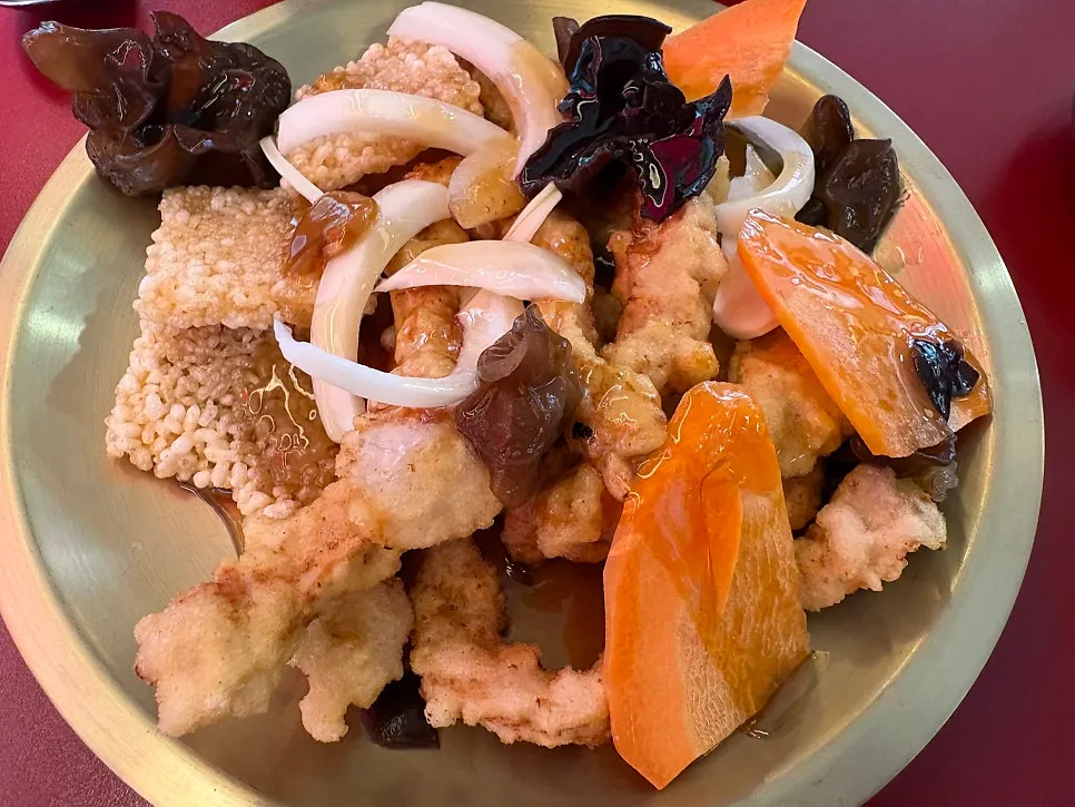 Nurungji tangsuyuk with thick sauce and crispy scorched rice on the side